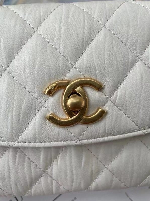 Chanel mini flap bag with top handle AS2477 white