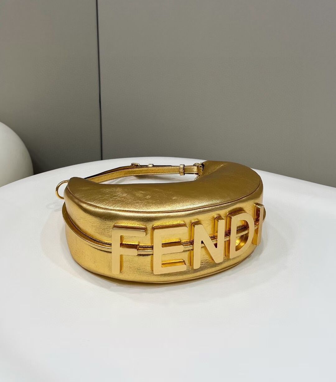 Fendigraphy Small Gold laminated leather bag 8BR798A