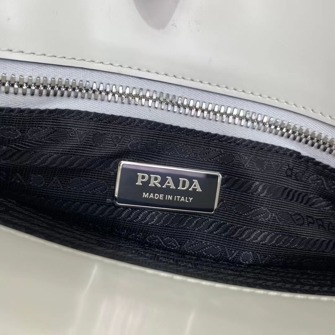 Prada Re-Edition 1995 brushed-leather medium handbag 1BA350 white