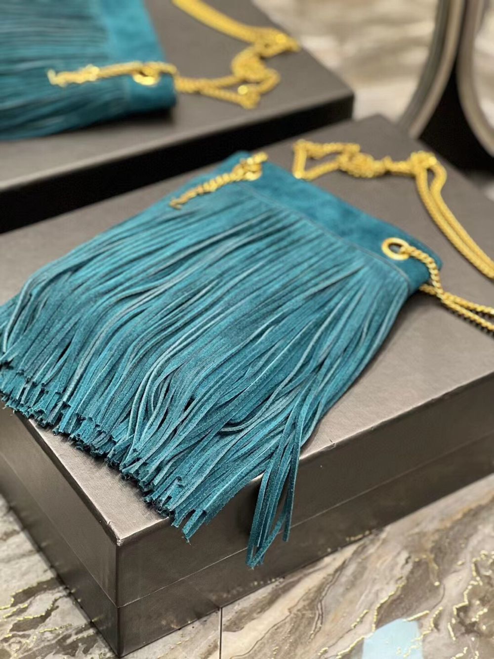 SAINT LAURENT SMALL CHAIN BAG IN LIGHT SUEDE WITH FRINGES 683378 blue