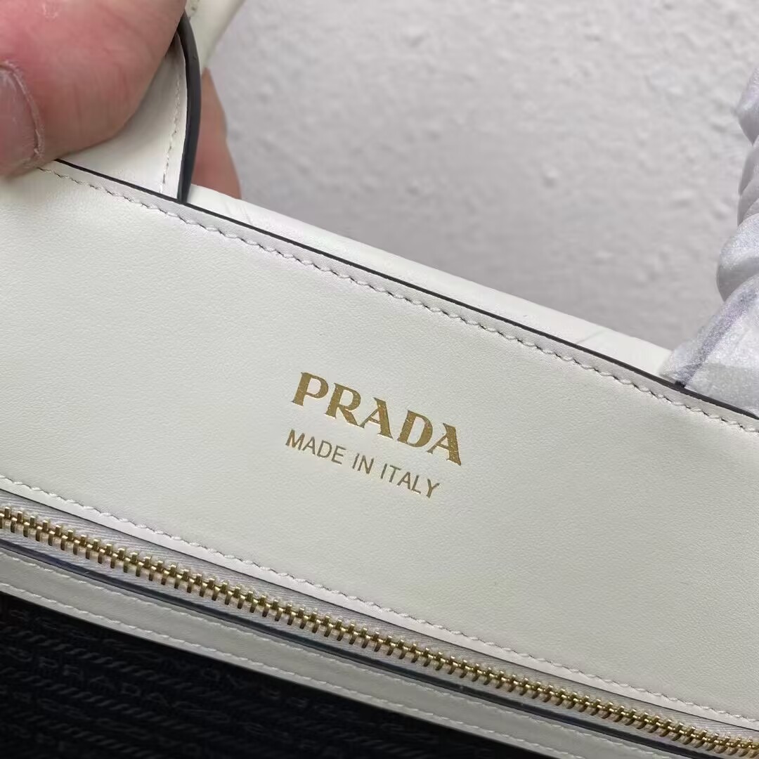 Small leather Prada Symbole bag with topstitching 1HH039 white